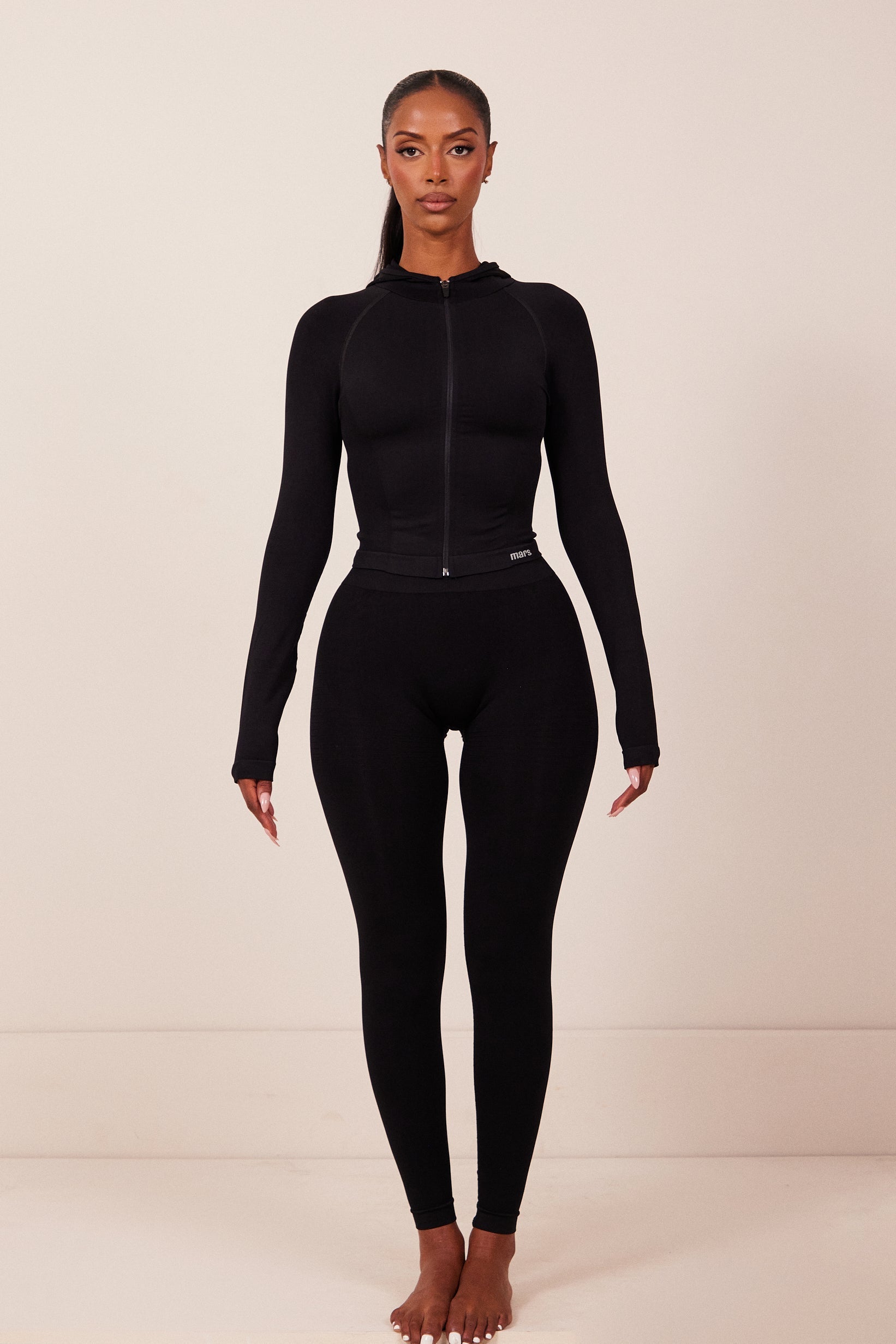 The Mars Seamless Hooded Zip Jacket in Black