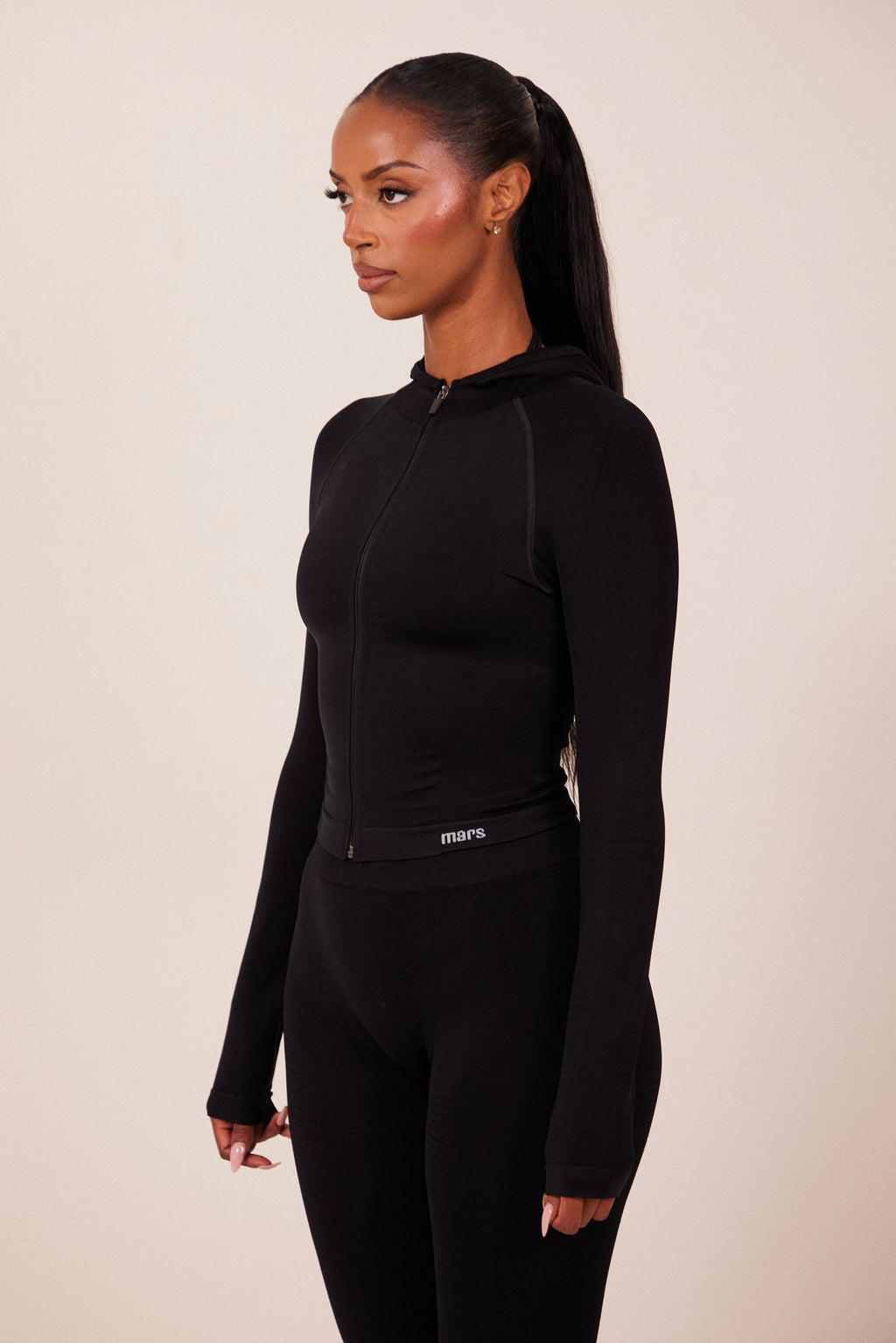 The Mars Seamless Hooded Zip Jacket in Black