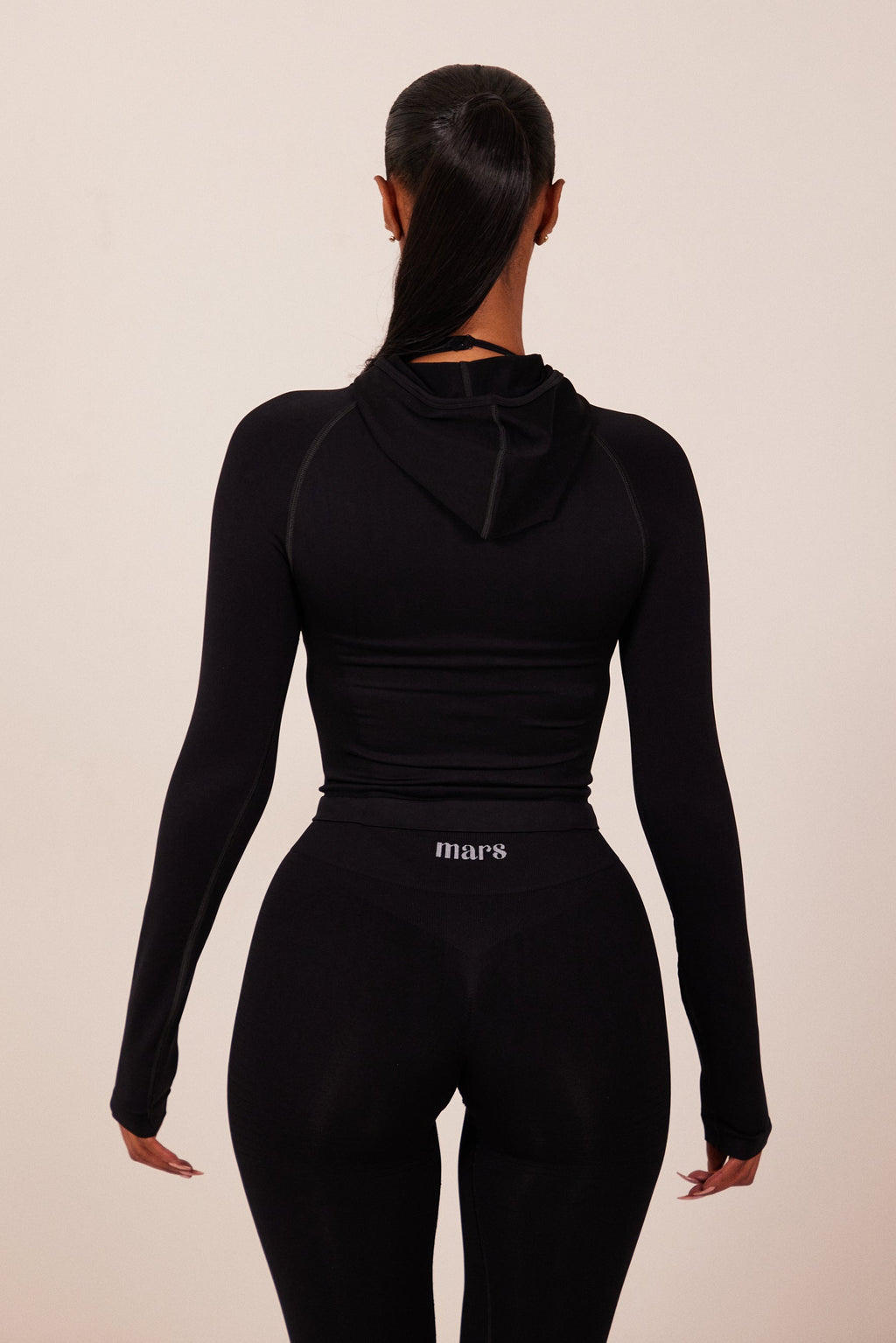 The Mars Seamless Hooded Zip Jacket in Black